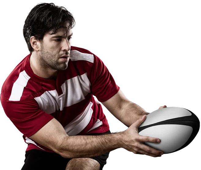 Joueur de rugby professionnel en mouvement se préparant à passer le ballon pendant un match, soulignant la performance athlétique, la concentration et le jeu dynamique.